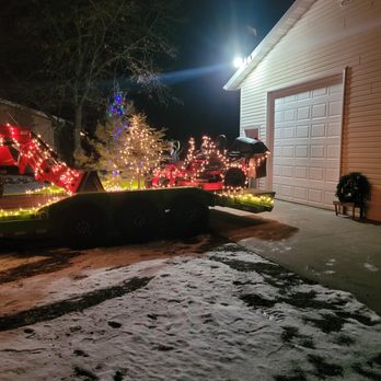 The Shrub Doctor - a driveway decorated with christmas lights - Lawn Services Near Me The Shrub Doctor - a driveway decorated with christmas lights - Lawn Services Near Me