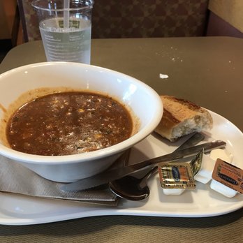 Panera Bread - My meal sloshed in a bowl, and a very hard baguette end, with complimentary crumbs on my table... - Sandwiches Near Me - Newport News, Virginia