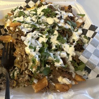 XX Tacos - a plate of food with a fork - Tacos Near Me - Sacramento, California XX Tacos - a plate of food with a fork - Tacos Near Me - Sacramento, California