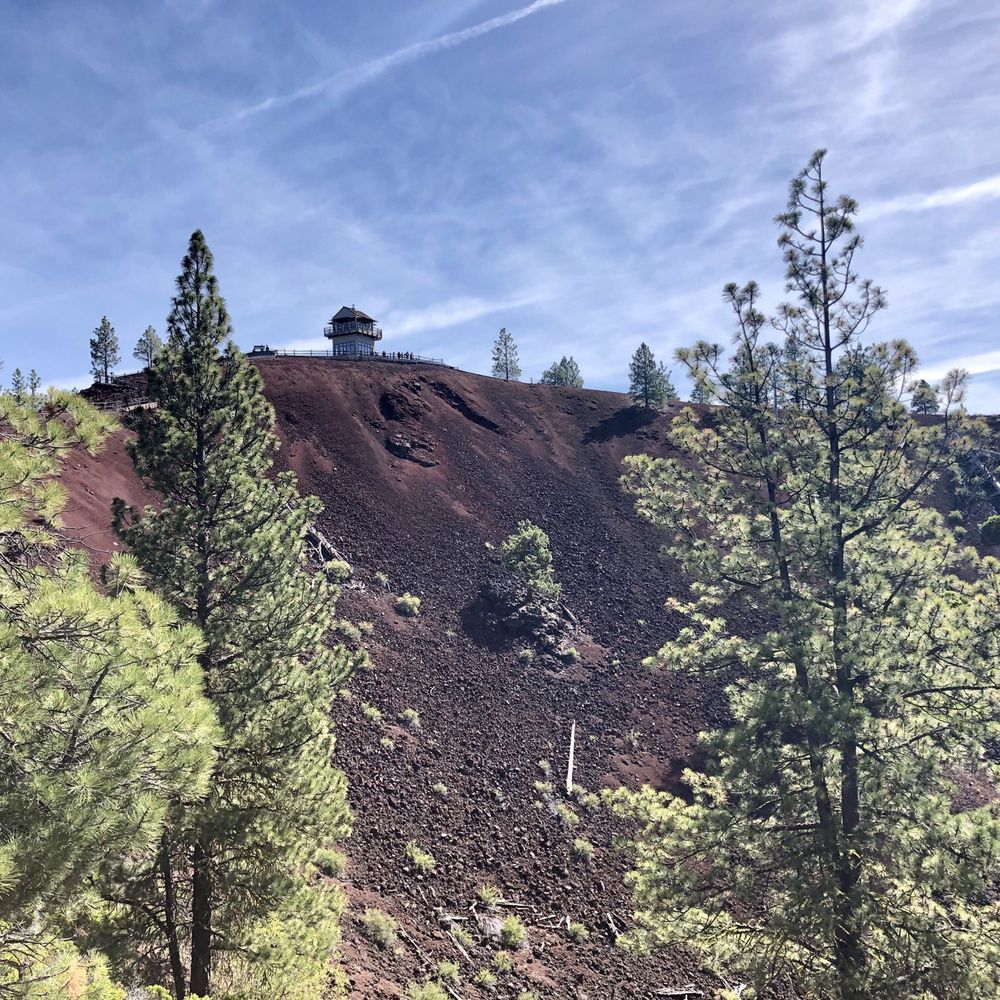 The iconic rusting red interior of the Lava Butte Crater shines on a sunny summer afternoon - Newberry National Volcanic Monument The iconic rusting red interior of the Lava Butte Crater shines on a sunny summer afternoon - Newberry National Volcanic Monument
