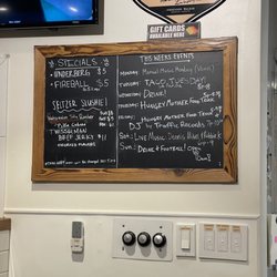 Ancient Owl Beer Garden & Bottle Shoppe - Sign with weekly specials and events