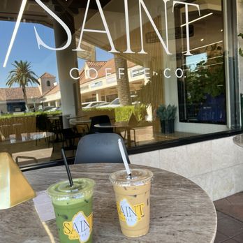 Saint Coffee - Window sign, a matcha tea latte, iced coffee latte - Coffee & Tea Near Me - Fresno, California Saint Coffee - Window sign, a matcha tea latte, iced coffee latte - Coffee & Tea Near Me - Fresno, California
