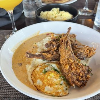 Kulture - Fried lamb chops w/ a mango lemon drop  His: pancakes, eggs, & turkey sausage link w/ strawberry mimosa - Southern Near Me - Houston, Texas