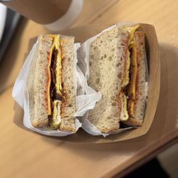 Snack Stop - A breakfast sandwich with bacon, egg, Eggs and Cheese and Bacon and Ham and Sausage Sandwich