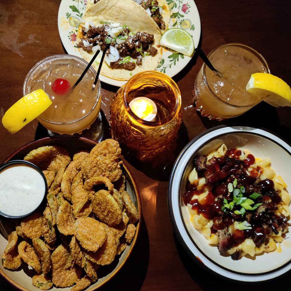 Six Shooter - plates of food and drinks on a table - Bars Near Me - Vancouver, Washington Six Shooter - plates of food and drinks on a table - Bars Near Me - Vancouver, Washington