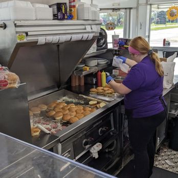 Bates Burgers - a woman preparing food in a restaurant - Burgers Near Me - Livonia, Michigan
