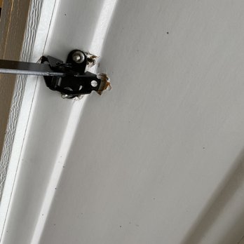 DMV Garage Doors - Legman technician installed the bracket into the door - Garage Door Services Near Me
