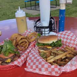 Northview Drive - Two cheeseburgers with lettuce and tomato, one has bacon. Onion rings and French fries.