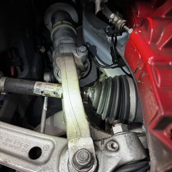 405 Motoring - Picture of damaged CV joint in front axle leaking grease because of careless spring install. - Auto Customization Near Me - Inglewood, California 405 Motoring - Picture of damaged CV joint in front axle leaking grease because of careless spring install. - Auto Customization Near Me - Inglewood, California