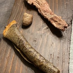 Salmon, duck heart, and duck neck treats from the raw bar. Yuck for US but super yummm for our poodle !! Salmon, duck heart, and duck neck treats from the raw bar. Yuck for US but super yummm for our poodle !!