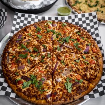Veggie Planet - a pizza on a checkered plate - Vegetarian Near Me - Ajax, Ontario