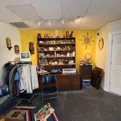 Sitting room with books, record player clothes