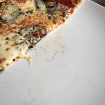 Greenhouse Kitchen + Bar - Hair underneath pizza - Cocktail Bars Near Me - Vienna, Virginia