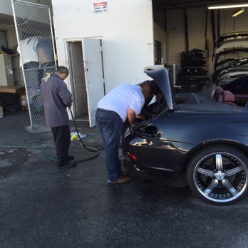 AW Collision - Walter analyzing car - Body Shops Near Me - Los Angeles, California