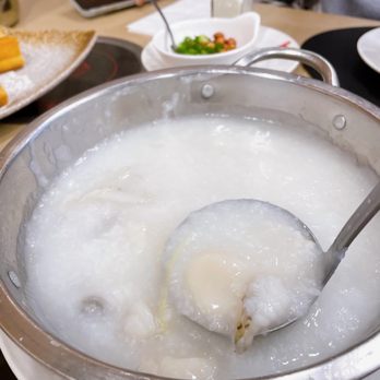 Garden City Hot Pot - a bowl of soup with a spoon in it - Dim Sum Near Me - Richmond, British Columbia