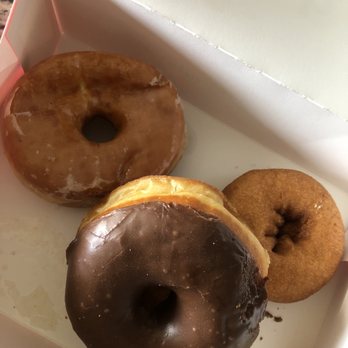 SK Donuts - What's left of my 1/2 dozen donuts: raised glaze, raise glazed chocolate, & cake donuts - Donuts Near Me - Union City, California