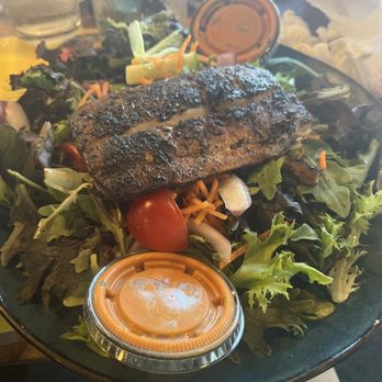 Crab's Claw Oceanfront Caribbean Restaurant - Salad with blackened mahi on top with homemade dressing - Seafood Near Me - Atlantic Beach, North Carolina Crab's Claw Oceanfront Caribbean Restaurant - Salad with blackened mahi on top with homemade dressing - Seafood Near Me - Atlantic Beach, North Carolina