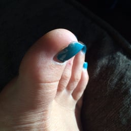 Long fake toe nail he had put on