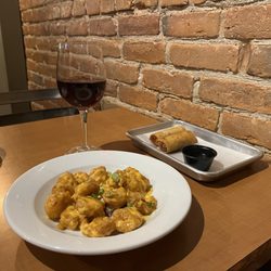 Toka Bocca Restaurant - Small plate of bong bong shrimp, spring rolls, Pinot noir.