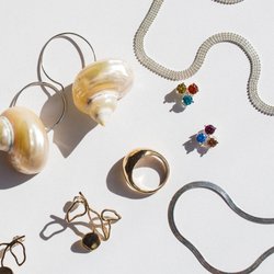 ARO - A combination of fine jewelry and contemporary jewelry we offer at ARO.  This picture features Tuza, Wolf Circus, Luiny and ARO in-house jew