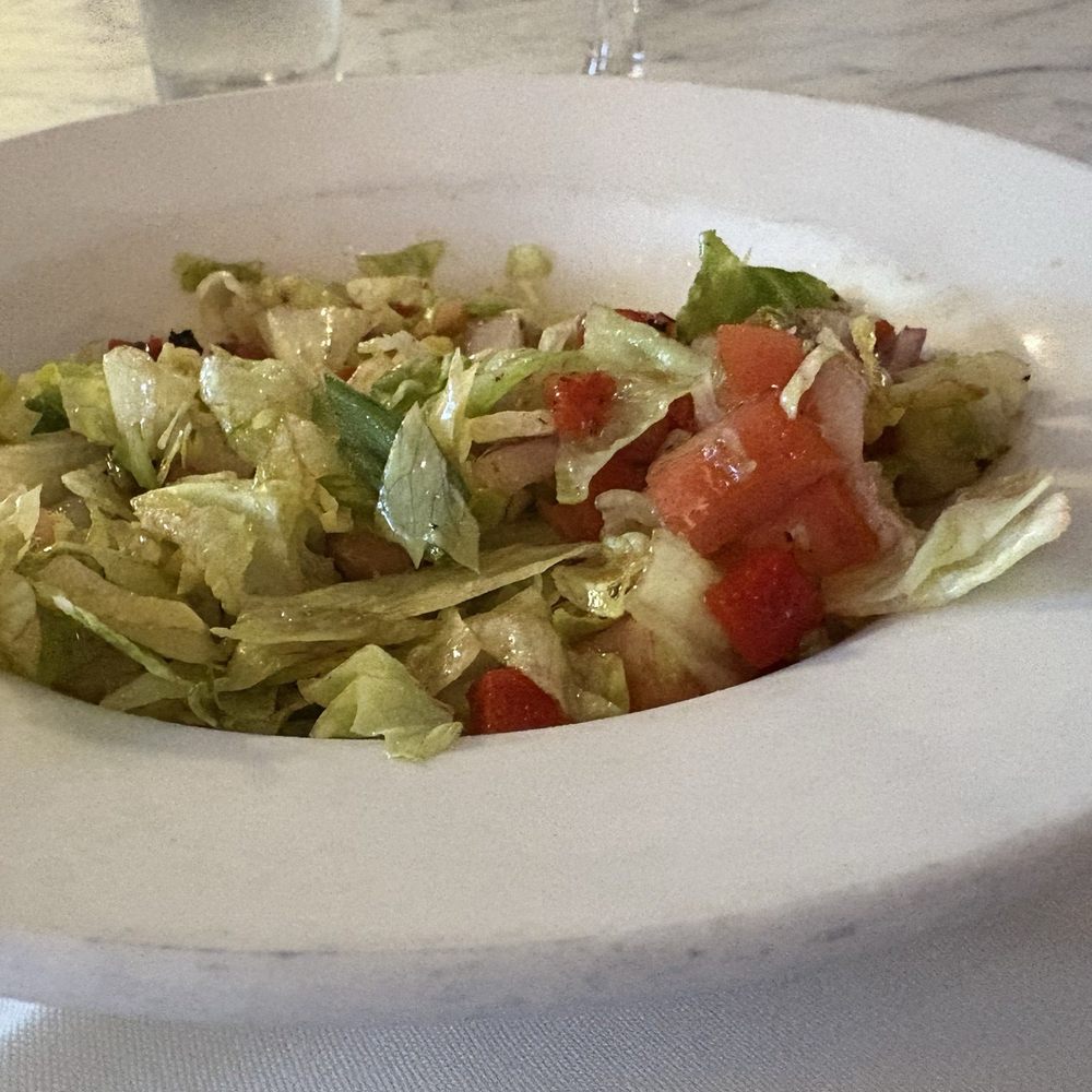 Matteo's Trattoria - House salad chopped with Romaine lettuce and fresh tomatoes and olives. - Italian Near Me - Boca Raton, Florida Matteo's Trattoria - House salad chopped with Romaine lettuce and fresh tomatoes and olives. - Italian Near Me - Boca Raton, Florida