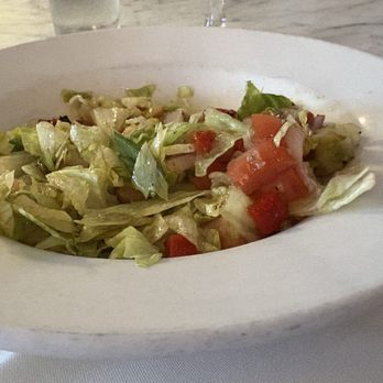Matteo's Trattoria - House salad chopped with Romaine lettuce and fresh tomatoes and olives. - Italian Near Me - Boca Raton, Florida Matteo's Trattoria - House salad chopped with Romaine lettuce and fresh tomatoes and olives. - Italian Near Me - Boca Raton, Florida
