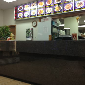 China Kitchen - a restaurant counter with a menu in the background - Chinese Near Me - Hampton, Georgia China Kitchen - a restaurant counter with a menu in the background - Chinese Near Me - Hampton, Georgia