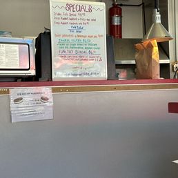 Specials! The flag day Sundae sounds good with vanilla soft serve, whipped cream, strawberries and blueberries only. $6.55 :)