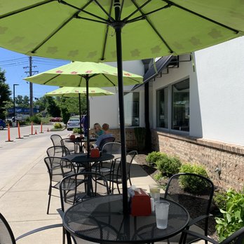 Chicken Salad Chick - tables and chairs with umbrellas - Southern Near Me - Louisville, Kentucky