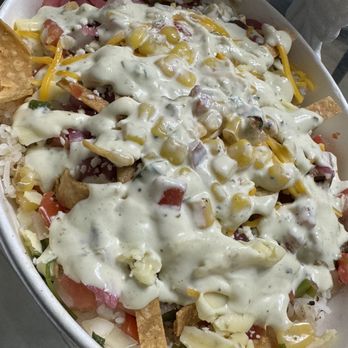 Condado Tacos - Chicken bowl with rice, tortilla strips, pickled onions, fajitas, rice, corn salsa, cilantro & onions, avocado lime aioli - Bars Near Me - Mason, Ohio