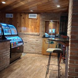 Coffee Hut in front of their new bar.
