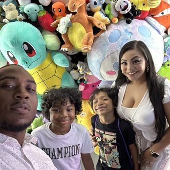 Claw Mania Kingdom - Family pic at front of Claw Mania - Arcades Near Me - Houston, Texas