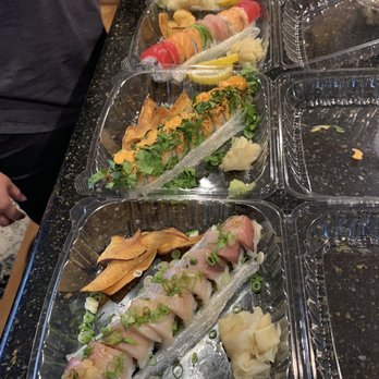 Nozomi - Salmon sashimi, cilantro salmon roll, yellowtail, and a rainbow roll. - Sushi Bars Near Me - La Jolla, California Nozomi - Salmon sashimi, cilantro salmon roll, yellowtail, and a rainbow roll. - Sushi Bars Near Me - La Jolla, California