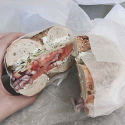 Kosher Bagel Hole - Everything bagel with salmon lox, scallion cream cheese, lettuce, tomato, and onions