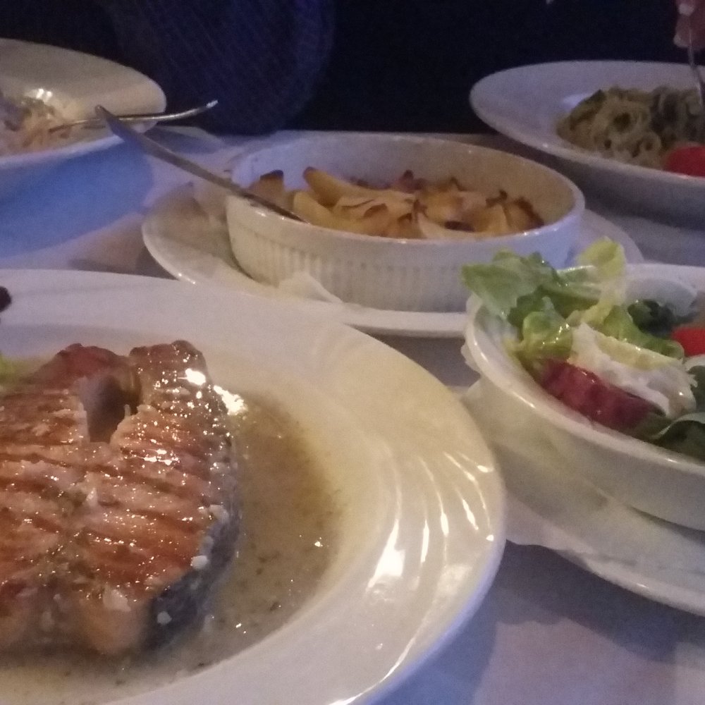 Rimini - Clockwise from bottom-left: salmon steak, spaghetti carbonara, rosemary potatoes, pesto noodles, and a side salad. - Pizza Near Me - Siegen, NW Rimini - Clockwise from bottom-left: salmon steak, spaghetti carbonara, rosemary potatoes, pesto noodles, and a side salad. - Pizza Near Me - Siegen, NW