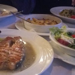 Rimini - Clockwise from bottom-left: salmon steak, spaghetti carbonara, rosemary potatoes, pesto noodles, and a side salad.
