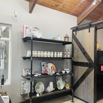 Ella's Olive Tasting Room - open shelves with dishes on them - Olive Oil Near Me - Kitty Hawk, North Carolina