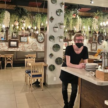 Rusticucina - Don't worry we're not checking out Leonardo.  It's the hanging greenery chandelier in the background that is this spots showstopper. - Italian Near Me - San Diego, California