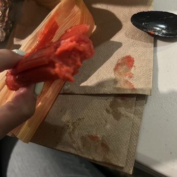 La Casa Del Pueblo - You can see the mushy still raw smears of the tamale on the napkin . - Mexican Near Me - Chicago, Illinois