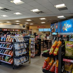 Jane & Major Mac Esso - Inside the convenience store looking at the Tim Hortons & the Frosters machine