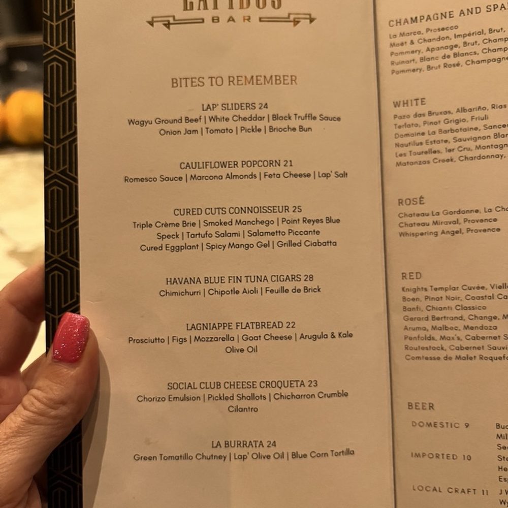Lapidus Bar - a hand holding a menu - Cocktail Bars Near Me - Miami Beach, Florida Lapidus Bar - a hand holding a menu - Cocktail Bars Near Me - Miami Beach, Florida
