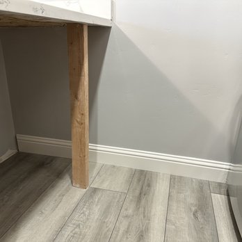 DRYWALL MASTERS - Kitchen wall repaired and painted, ready for the cabinets to be installed. - Drywall Installation & Repair Near Me
