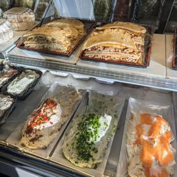 a variety of sandwiches in a display case
