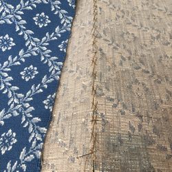 Sewing a seam by hand.