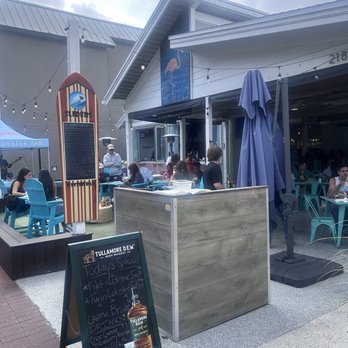 Sliders Oyster Bar - Outdoor patio seating - Seafood Near Me - Neptune Beach, Florida Sliders Oyster Bar - Outdoor patio seating - Seafood Near Me - Neptune Beach, Florida