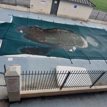 Days Inn by Wyndham Salisbury - Trash on pool cover old dirty mattress beside it with broken chair - Hotels Near Me - Salisbury, Maryland Days Inn by Wyndham Salisbury - Trash on pool cover old dirty mattress beside it with broken chair - Hotels Near Me - Salisbury, Maryland