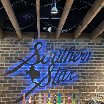 Southern Star Brewing - a brick wall with a neon sign - Breweries Near Me - Conroe, Texas Southern Star Brewing - a brick wall with a neon sign - Breweries Near Me - Conroe, Texas