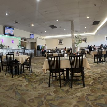 Saigon Basil - the inside of a restaurant with tables and chairs - Vietnamese Near Me - Northglenn, Colorado Saigon Basil - the inside of a restaurant with tables and chairs - Vietnamese Near Me - Northglenn, Colorado
