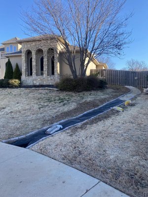 Before & During - A French drain on both sides of the front and backyard, as well as adding four zones of irrigation to the existing irrigation system, in which we repaired and got operational a couple months prior. Here are a few photos of the current project in progress which shows our French drain layout, as well as the drainage and irrigation trenches opened up and ready for pipe.
