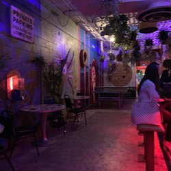 Mecca - When you first walk in, this is to the left. Bar area, small tables with chairs & a couch along with a ping pong table.
